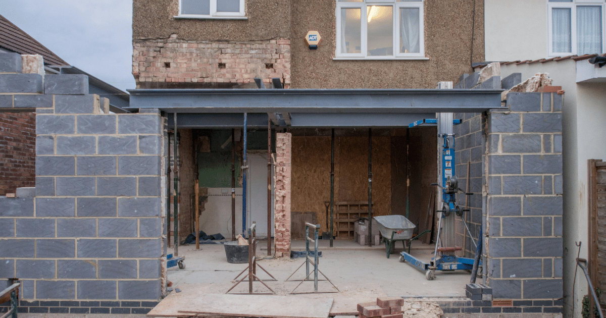 Rear extension build in progress with blockwork and steel frame, showing a typical UK house extension and simple structural design.